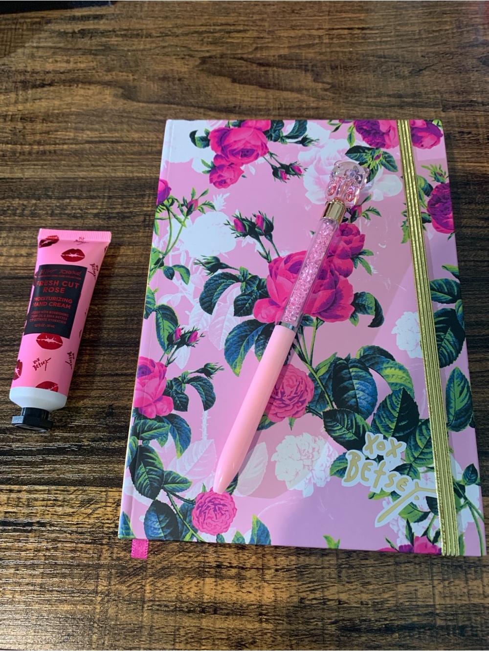 XOX BETSEY JOHNSON Floral Pink Hardcover Notebook with Additional items.